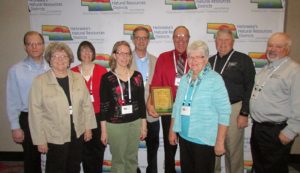 (L to R) Director of the Year award includes: Andy Hadenfeldt – Family Nancy Hadenfeldt – Family Joan Larson – Family Brenda Hadenfeldt – Family Michael Greer – Family Richard Hadenfeldt – Award Winner Jan Hadenfeldt – Richard’s wife Leon (Butch) Koehlmoos – General Manager of Lower Loup NRD Jim Eschliman – Board member of Lower Loup NRD