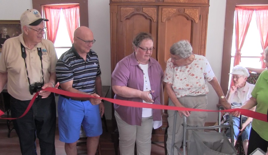 Gentry Log Cabin home celebrates grand opening