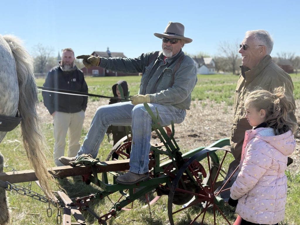 Horse drawn plows prepare the site of the Nebraska Hand Cornhusking Contest