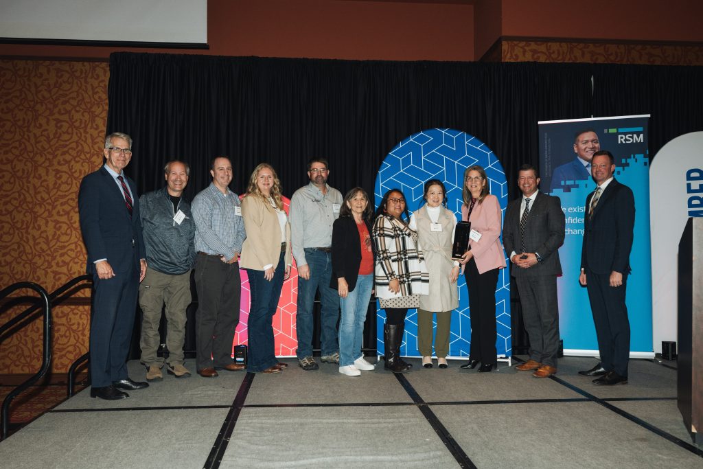 The Nova-Tech team accepts the award alongside Lieutenant Governor Joe Kelly, Lowell Ferguson and NE Chamber President & CEO Joseph Young.