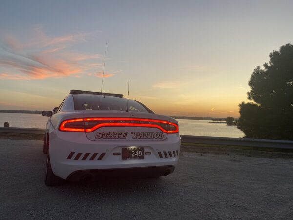 A police cruiser parked with its lights on